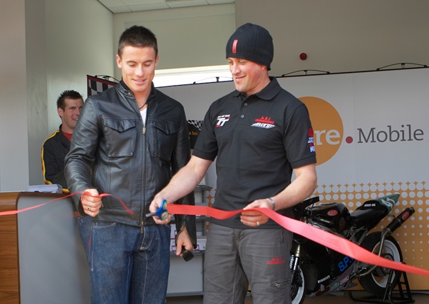 James Toseland and Nick Crowe cut the ribbon at the Sure Mobile TT Grandstand shop as David Knight looks on